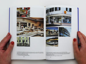 Double page du livre Bévilard dans l'Histoire comportant une grille de photographies. Les images représentent divers commerces de la commune de Bévilard.